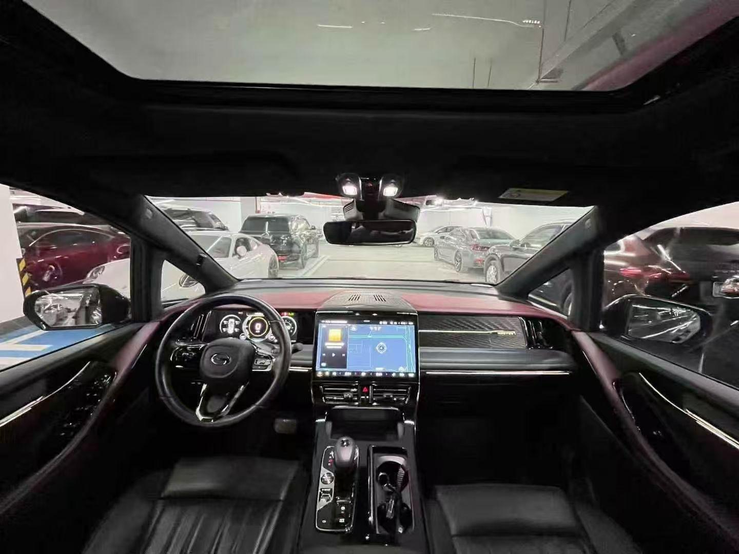 Vehicle interior with panoramic roof and dashboard